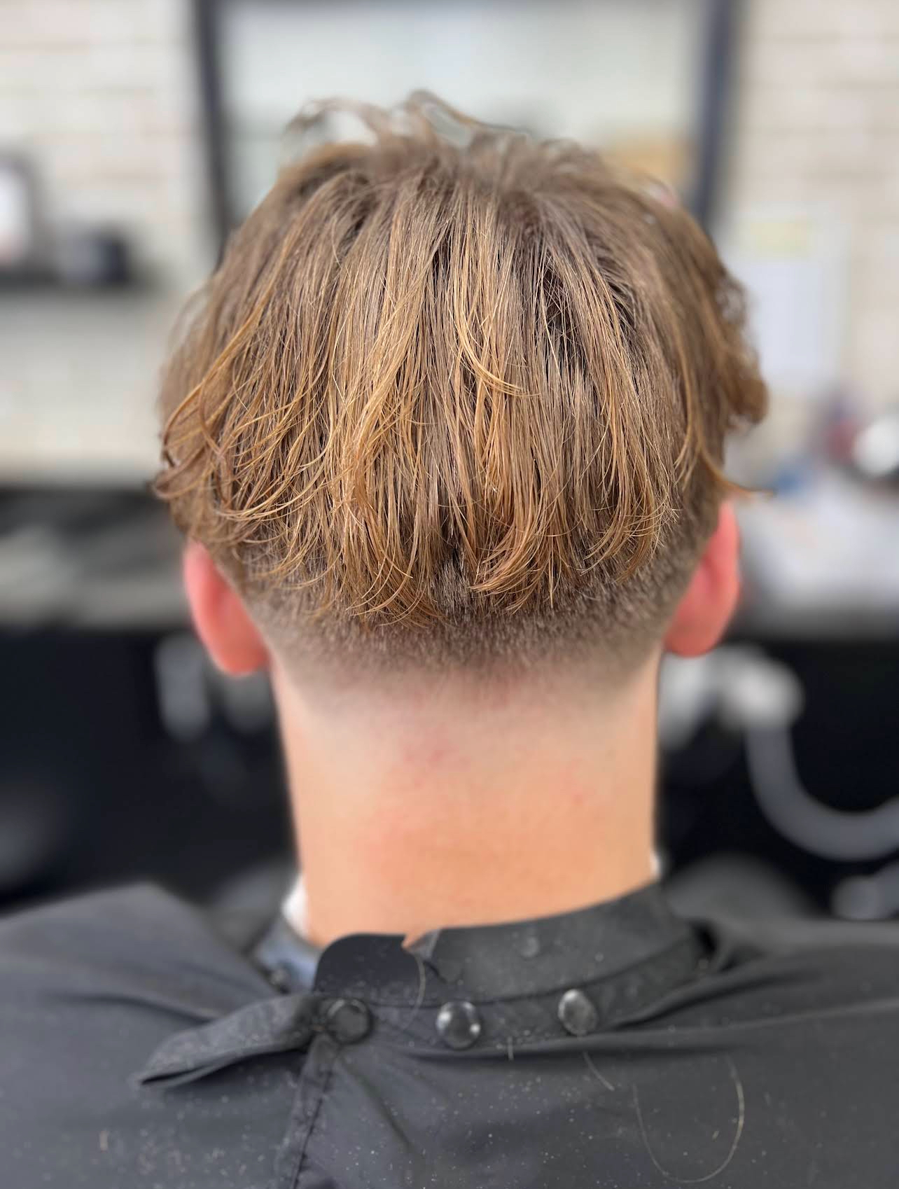 Layered textured cut with taper — client back view